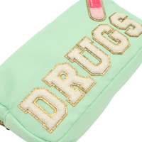 Close view of chenille Drugs lettering and pill patch