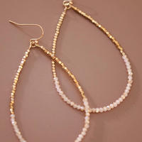 Gold and cream beaded teardrop earrings