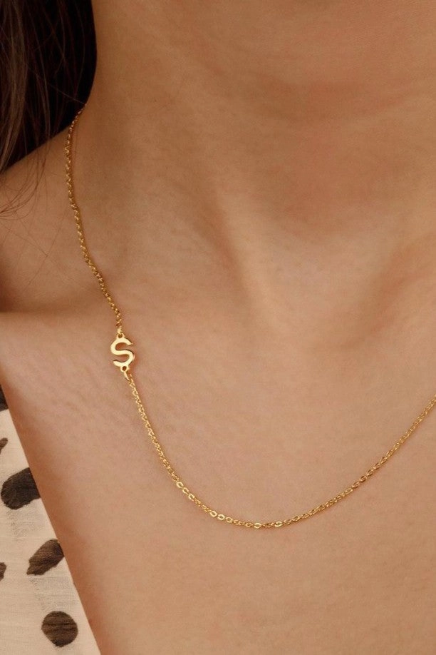 Initial necklace shown on model