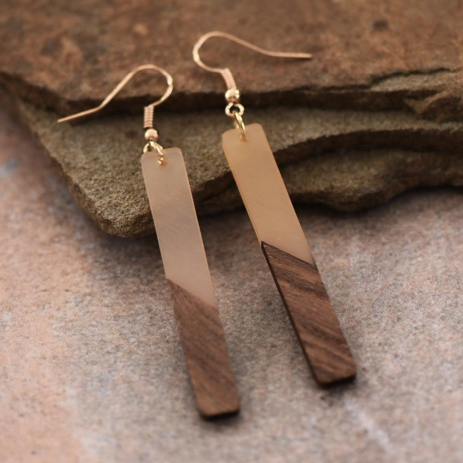 Nude resin and natural wood bar drop earrings, front view