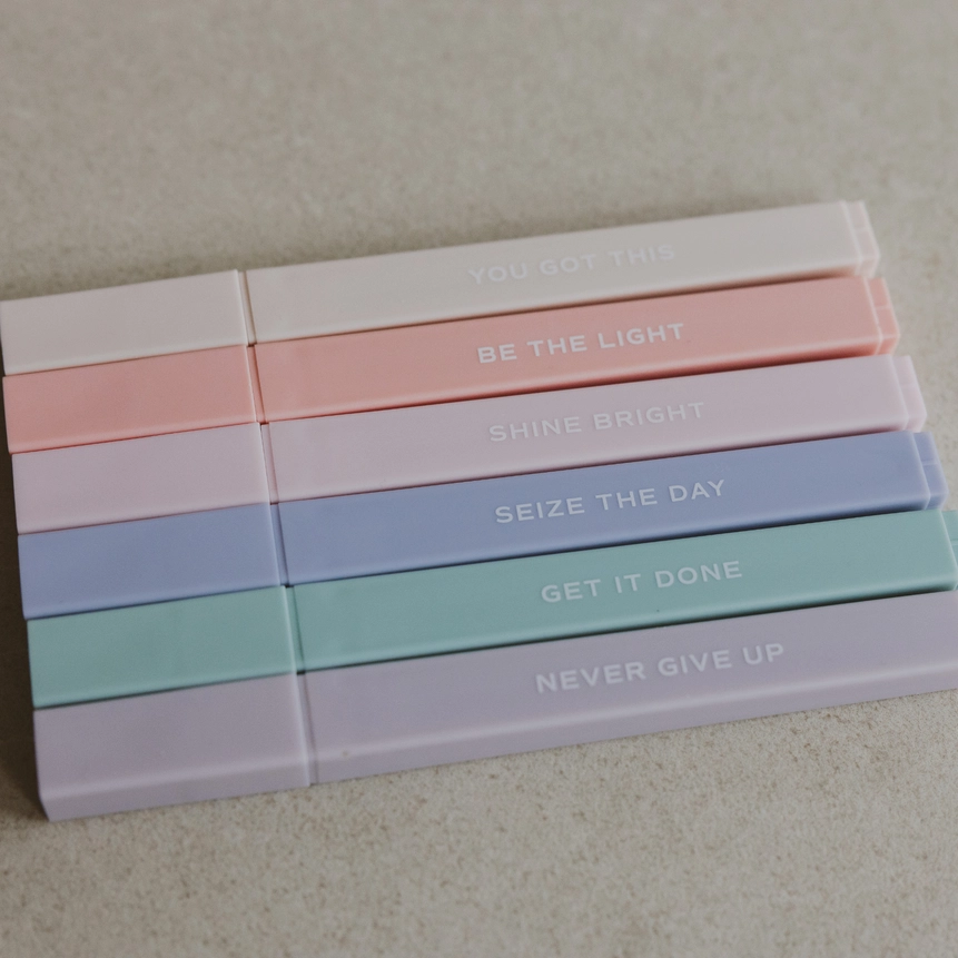 Motivational messages printed on neutral pastel highlighters