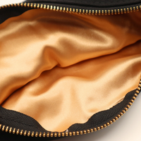 Gold satin interior of Good Moms canvas pouch