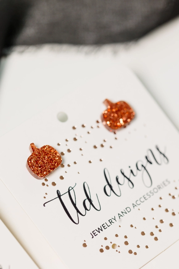 Orange glitter acrylic Pumpkin Stud Earrings close-up